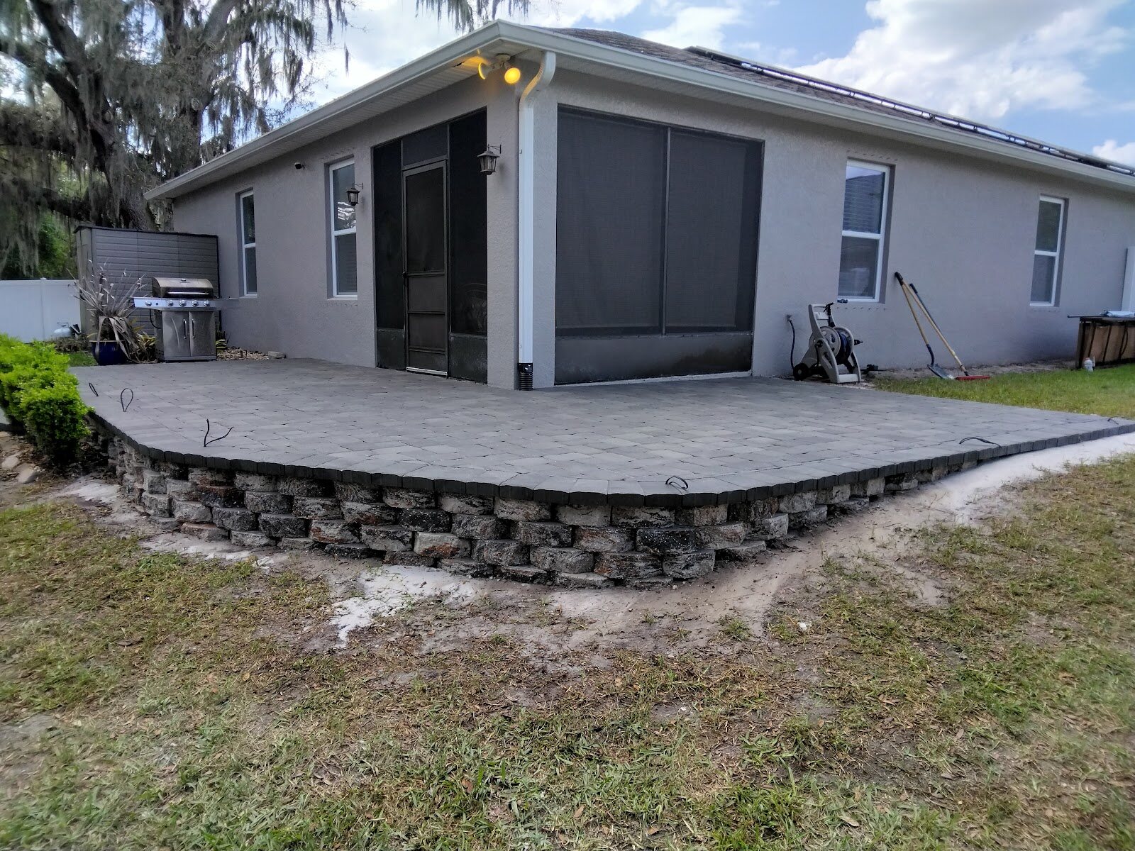 Expert Stone & Brick Pavers raised patio and stone wall project walkthrough